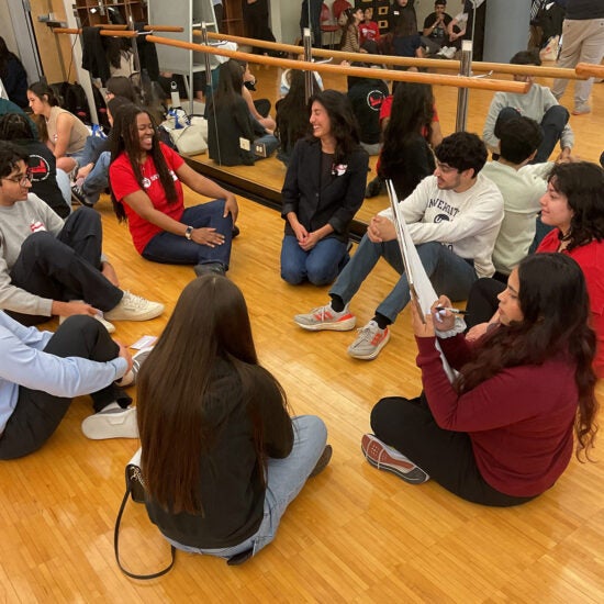 students sitting in a circle working together