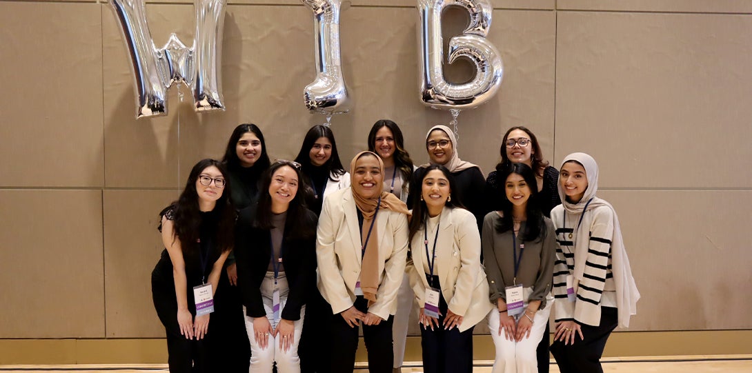 United Women's Network (UWN) Club members posing at the 10th Annual Women in Business Conference.